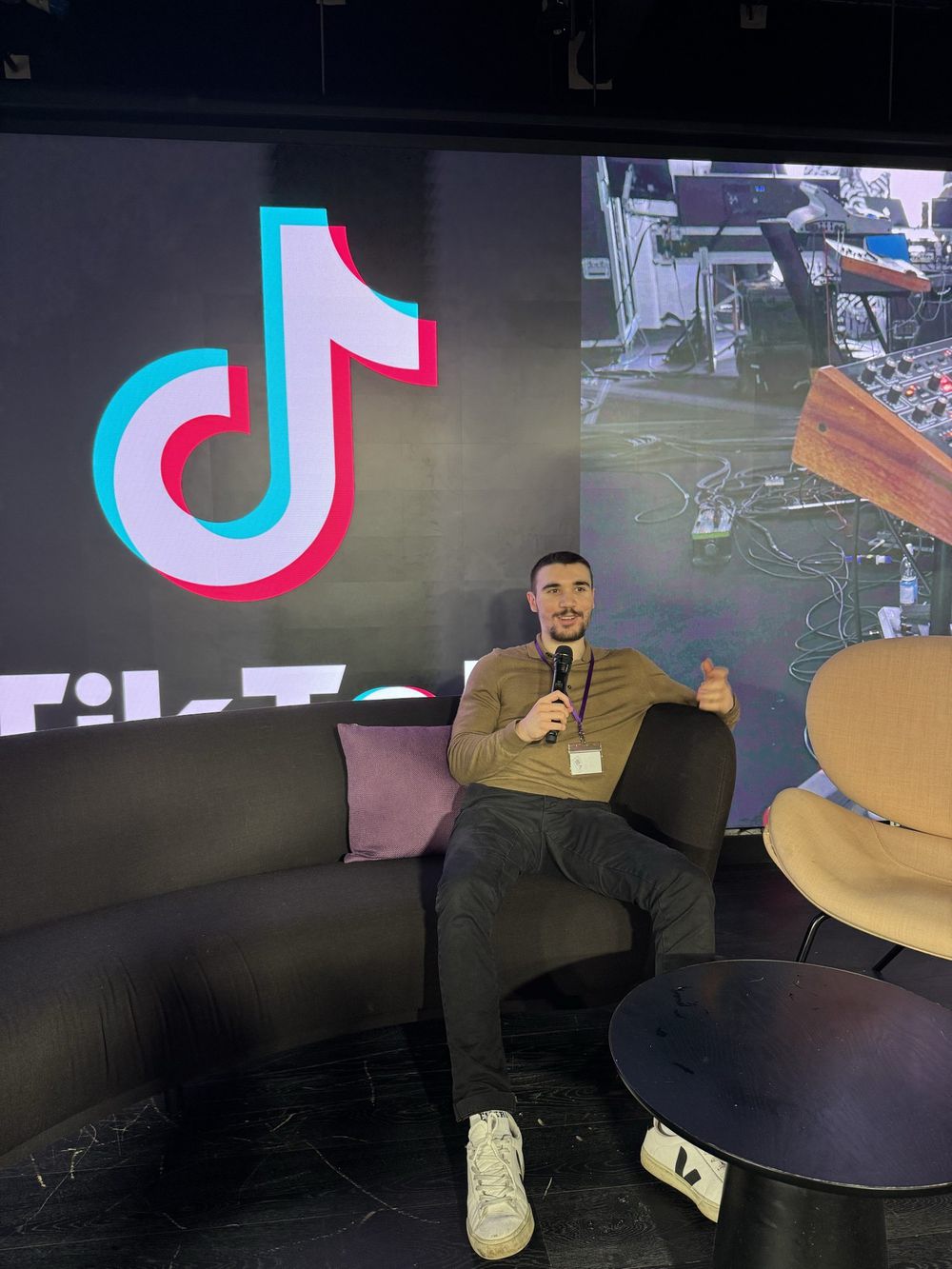 Deniz Sancar on stage at a TikTok for Business event